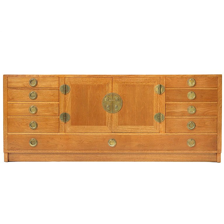 a Modernist sideboard cabinet with unique bronze hardware.