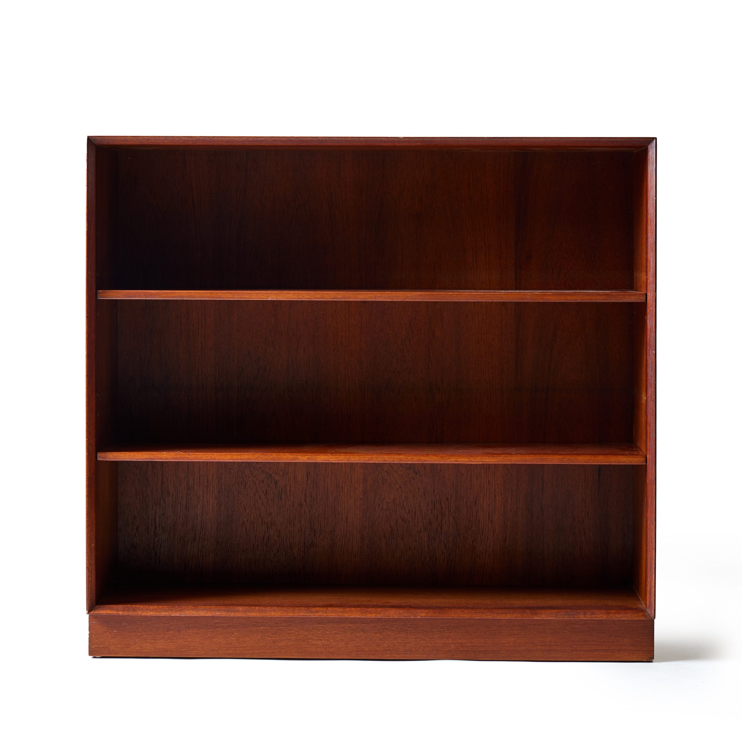 A Solid Teak Bookcase With Adjustable Shelving